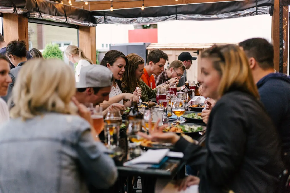 Warm shared table used as temporary lifestyle placeholder photography